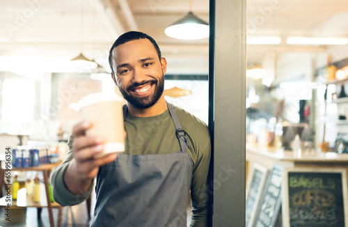Portrait, happy man or barista with smile for coffee cup in hand for customer. African, person or employee of small business with order of cappuccino, latte or drink in store, cafe or shop for offer