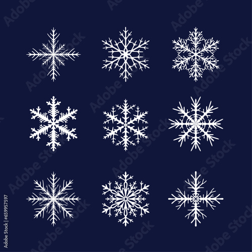 Set of nine white openwork snowflakes on a blue background