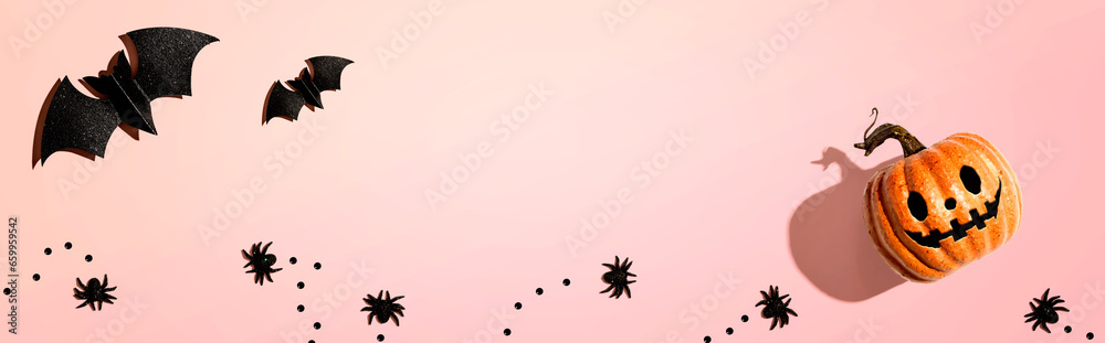 Fotografie Halloween pumpkin ghost with bats and spiders - flat lay