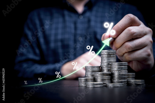 Businessman hand drawing virtual increasing graph with heap of coins stacking and percentage, Business investment profit and deposit dividend saving growth concept.