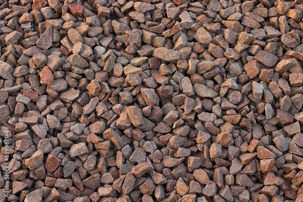 Large stones of different shapes close-up. there are a lot of small stones nearby.