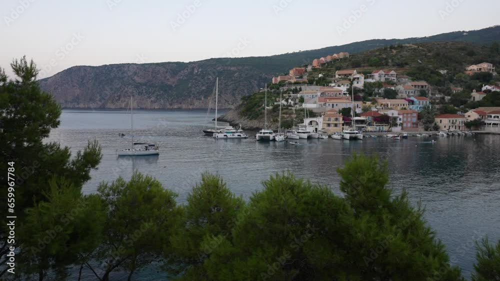 View of harbour and colourful houses in Assos, Assos, Kefalonia (Cephalonia), Ionian Islands, Greek Islands View of harbour and colourful houses in Assos, Assos, Kefalonia (Cephalonia), Ionian Islands, Greek Islands