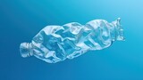 Empty rumpled used plastic bottle on blue background. Top view, copy space. Pollution, environmental protection concept. Reuse garbage, recycle, plastic free. Earth, world water day.