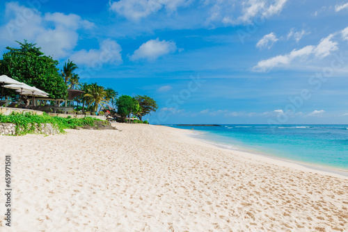 Luxury beach. Scenic coastline with coconut palms at tropical island.