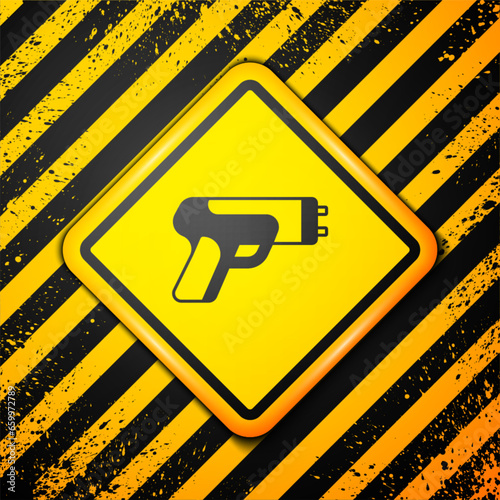 Black Police electric shocker icon isolated on yellow background. Shocker for protection. Taser is an electric weapon. Warning sign. Vector