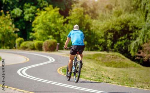 Cyclist ride on the bike path in the city Park 