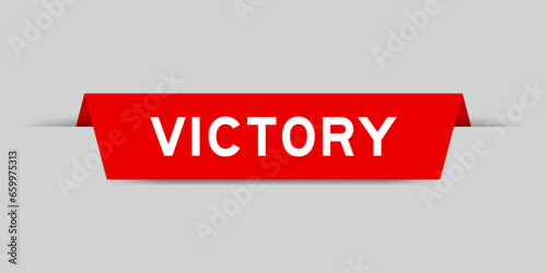 Red color inserted label with word victory on gray background
