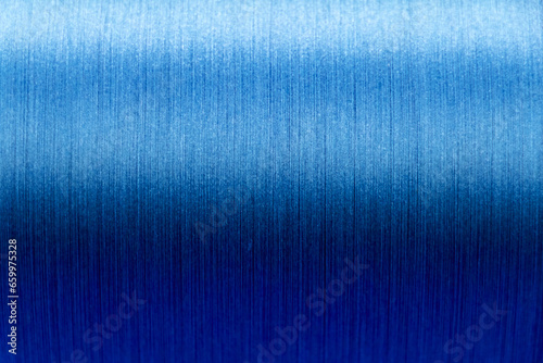 Closed up of blue color of thread textured background  Focus at center of picture 