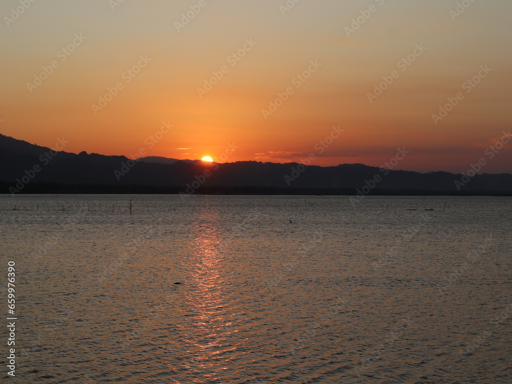 Beautiful golden sunset on the lake
