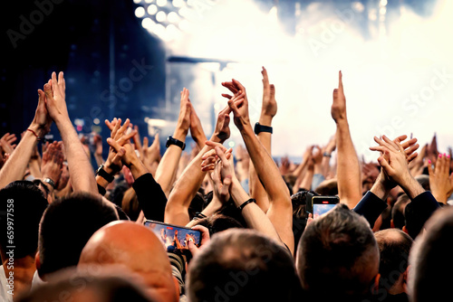 A lot of hands, crowd on concert. photo