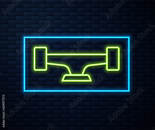 Glowing neon line Skateboard wheel icon isolated on brick wall background. Skateboard suspension. Skate wheel. Vector