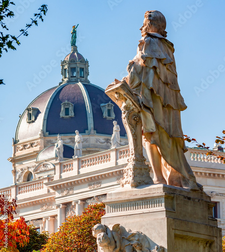 Photography Wolfgang Amadeus Mozart statue in autumn Burggarten park, Vienna, Austria