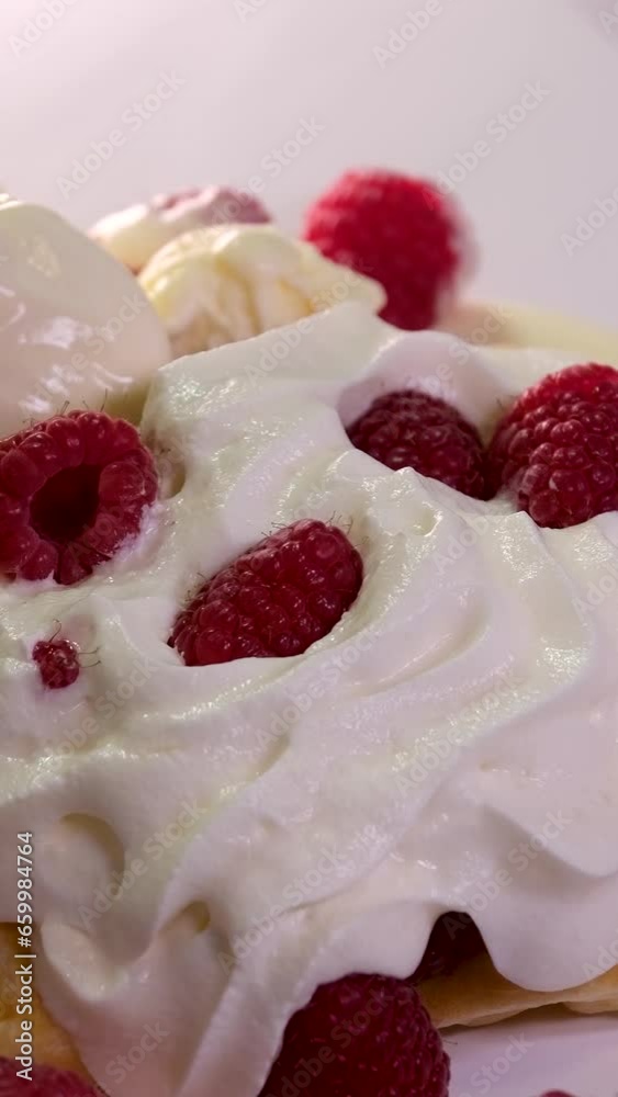 vertical video process of preparing sweet delicious waffles in electric waffle iron beat ingredient eggs flour add sugar close-up cooking show recipe. Breakfast with raspberries decorate set of videos vertical video process of preparing sweet delicious waffles in electric waffle iron beat ingredient eggs flour add sugar close-up cooking show recipe. Breakfast with raspberries decorate set of videos