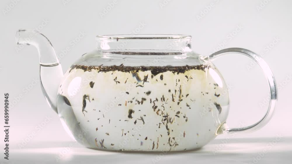 Making tea in the transparent glass teapot