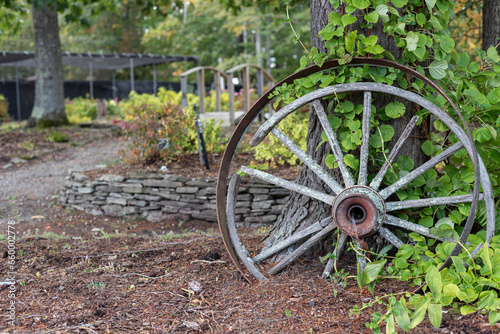 Old wagon wheel used as decoration at a farm in the Fall