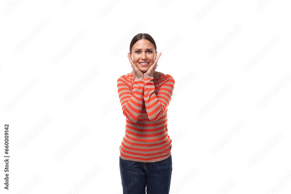 young smiling european slim woman dressed in a casual orange sweater and jeans on a white background with copy space young smiling european slim woman dressed in a casual orange sweater and jeans on a white background with copy space