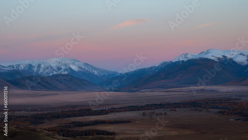 Soft mountains at sunset. Purple sunset over majestic mountains.