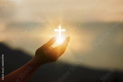 Human hands open palms up to worship hope with the Cross is a symbol of Christianity.Concept Religion and spirituality with believe Power of hope or love and devotion. fighting and victory for god.