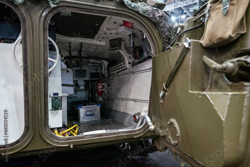 Rear cargo interior of tactical vehicle, heavy armoured back door opened