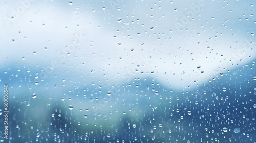 Close up of Rain Drops on a Window. Blurred Snow Landscape Background