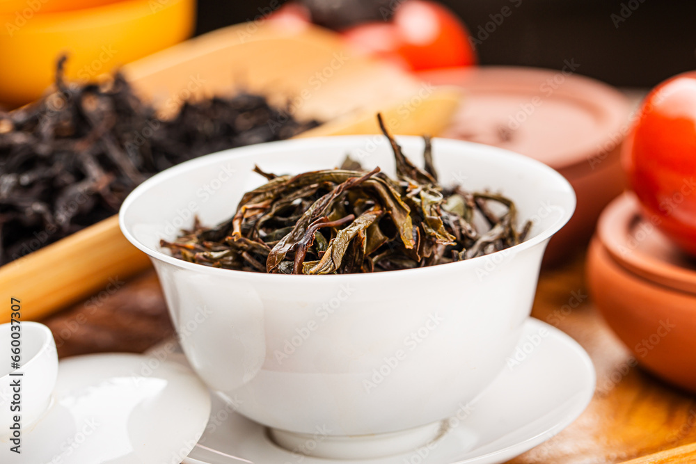 Fototapeta premium Brewing Chinese tea in ceramic gaiwan during the tea ceremony close-up.