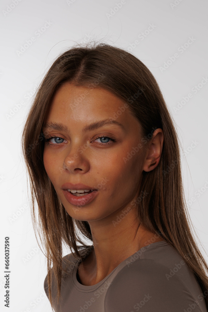 Beautiful young girl with fresh healthy skin. Woman advertise ear-rings. White background. Earrings, ear caffs closeup. Blond european woman with long hair with big lips, pretty smile. Cosmetology Beautiful young girl with fresh healthy skin. Woman advertise ear-rings. White background. Earrings, ear caffs closeup. Blond european woman with long hair with big lips, pretty smile. Cosmetology