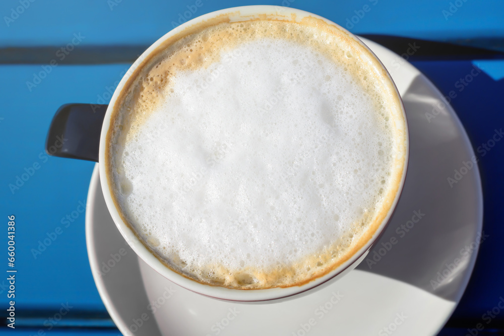 Foam on coffee in a cup from above on a blurred background Foam on coffee in a cup from above on a blurred background
