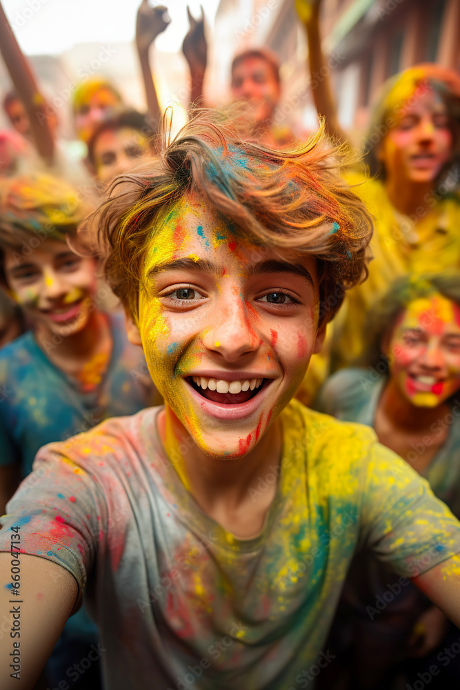 Kids taking a selfie in a holi party. Young boys and girls covered with colored paint smiling and enjoying Kids taking a selfie in a holi party. Young boys and girls covered with colored paint smiling and enjoying