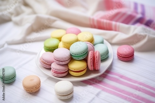 colorful macarons arranged on a white tablecloth
