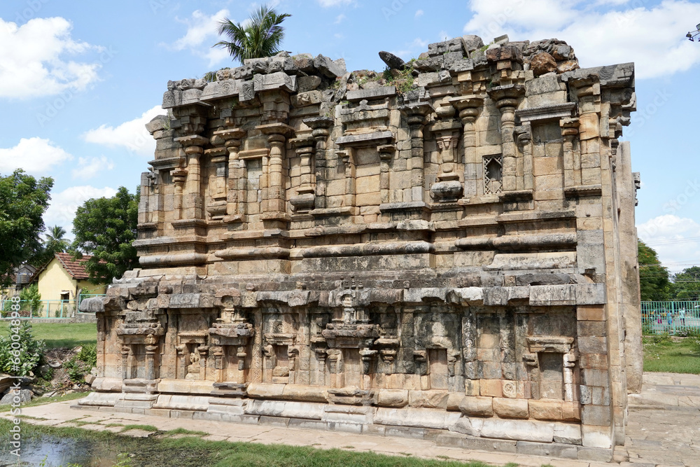 Ruined facade of ancient historic Airavatesvara Temple in Darasuram, Kumbakonam, Tamilnadu. Ruined Stone wall with relief carvings of God sculpture.