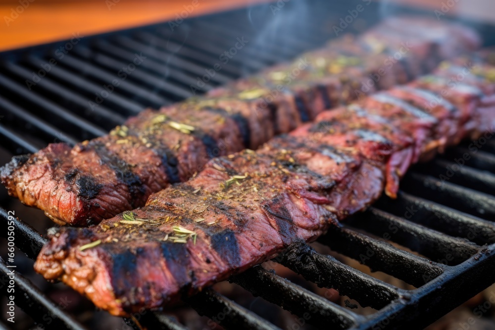 grill marks on marinated skirt steak on barbecue