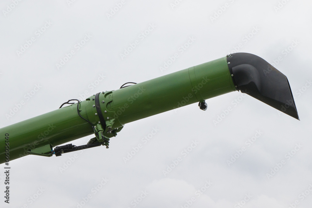Metal pipe as part of combine harvester machine. Agricultural equipment Metal pipe as part of combine harvester machine. Agricultural equipment