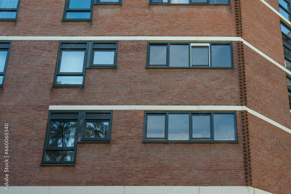 Brick facade  building with a new windows