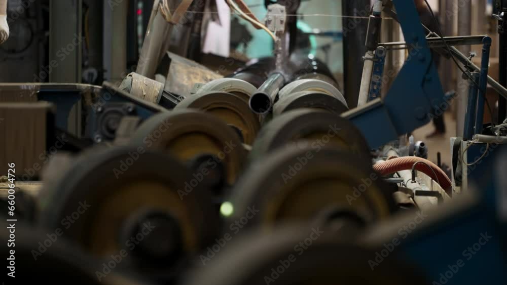 Automated pipe processing conveyor line at the production factory ...