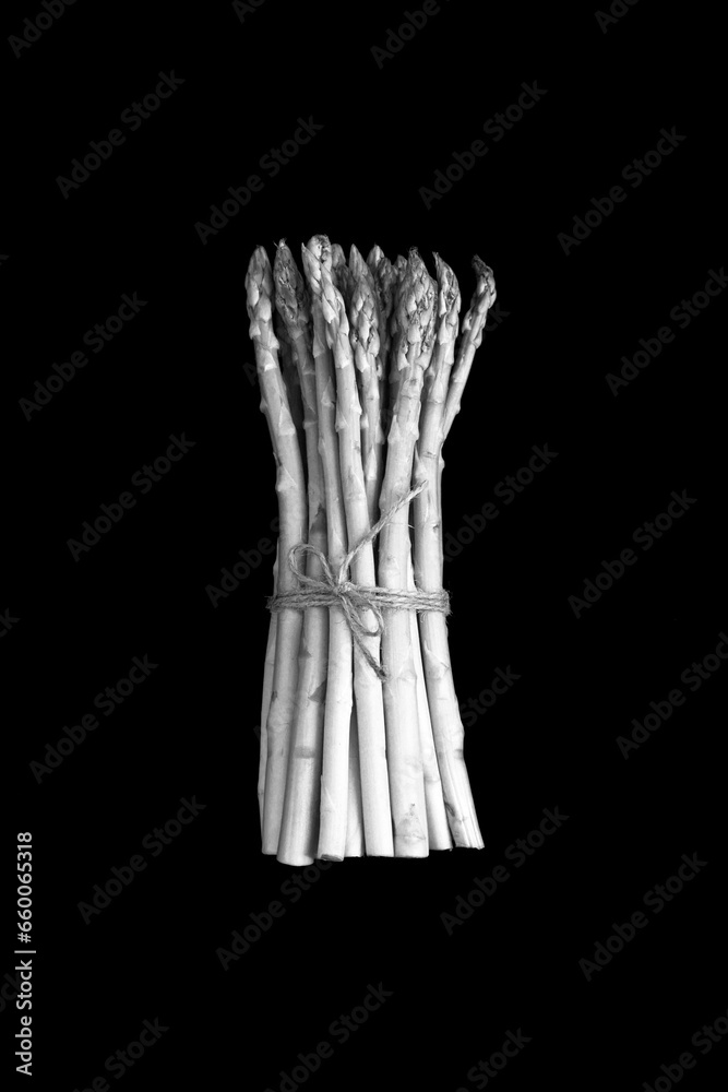 Fotografie White asparagus on the black background