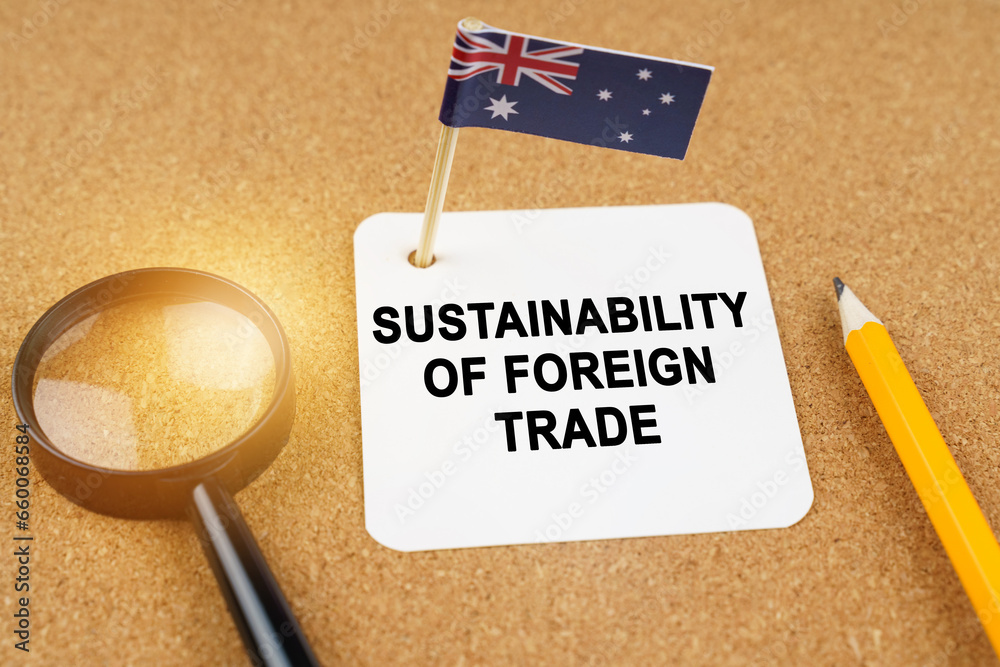 Φωτογραφία On the table is the flag of Australia and a sheet of paper with the inscription