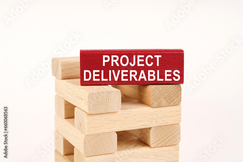 On the wooden planks there is a red one with the inscription - Project deliverables photo