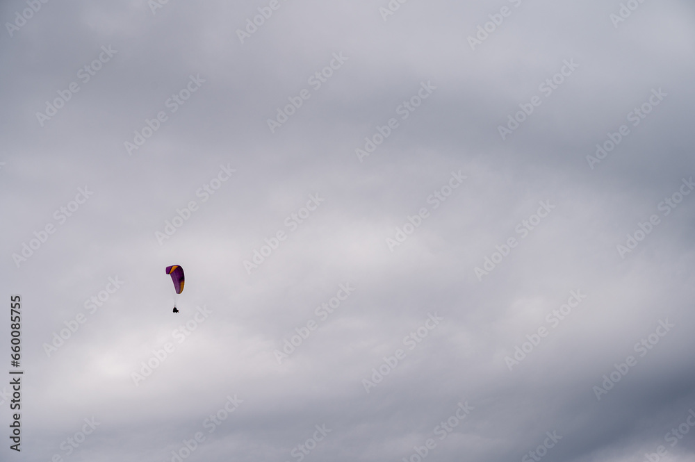 parachutist in the sky above the mountains in the valley, active recreation in the Ukrainian mountains parachutist in the sky above the mountains in the valley, active recreation in the Ukrainian mountains