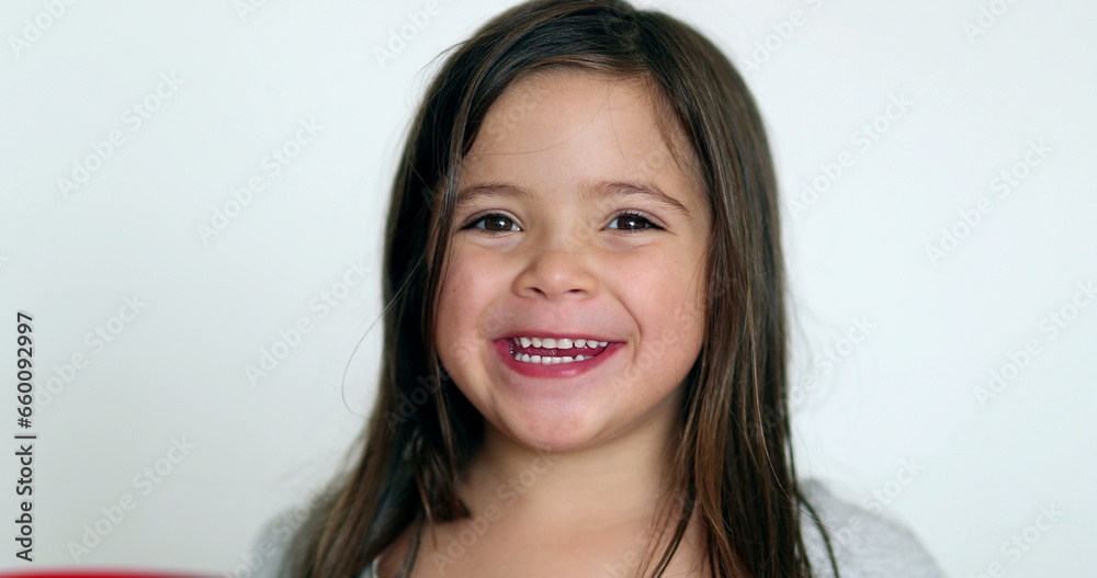 Happy little girl smiling at camera. Cute adorable child portrait face Happy little girl smiling at camera. Cute adorable child portrait face