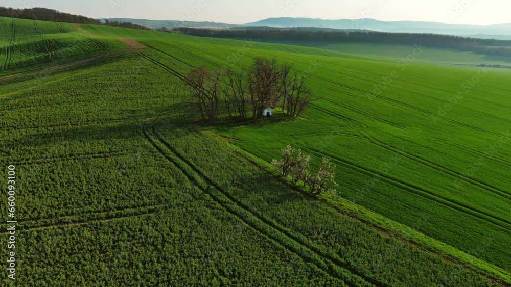 Aerial around view of Chapel st. Barbara on South Moravian hill fields during spring time, Moravia, Czech Republic, 4k Aerial around view of Chapel st. Barbara on South Moravian hill fields during spring time, Moravia, Czech Republic, 4k