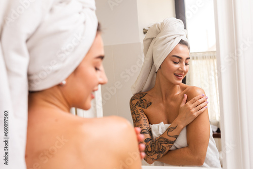 A young woman takes a bath and takes care of her skin in the luxury room