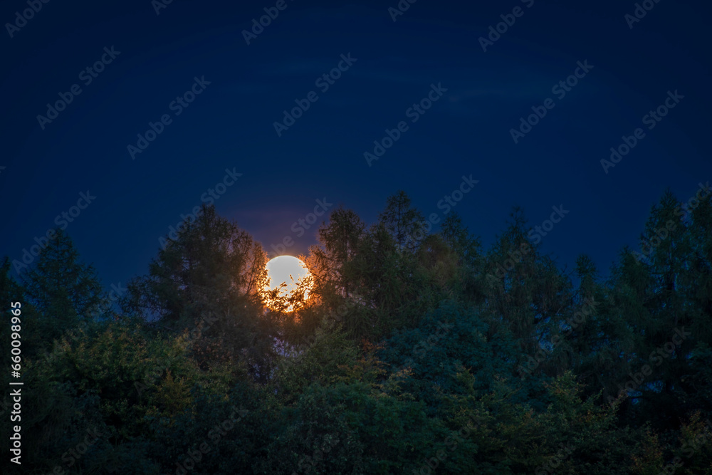 Moonrise view near Nemci village in Ceske Stredohori mountains Moonrise view near Nemci village in Ceske Stredohori mountains