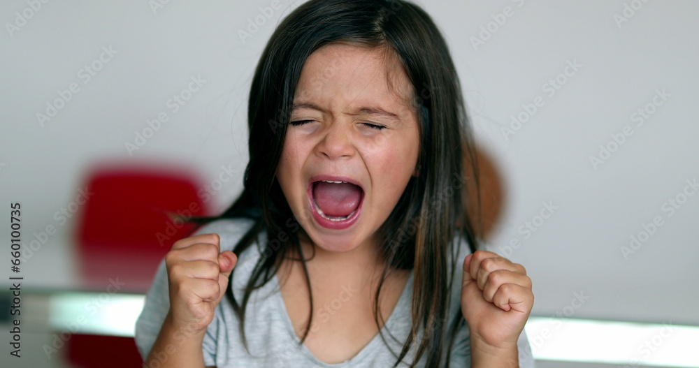 Upset little girl yelling feeling angry Upset little girl yelling feeling angry