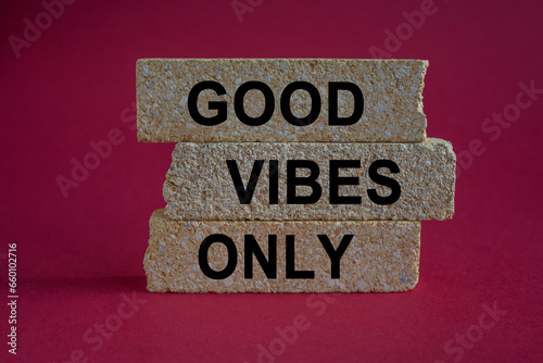 Concept word Good vibes only on brick blocks. Beautiful red background. Business motivational good vibes only concept. Copy space.