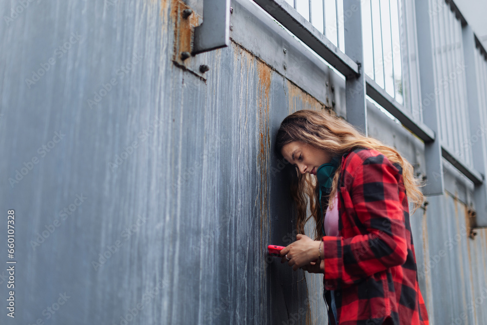 Fototapeta premium Gen Z girl outdoors in the city, feeling sad, anxious and alone. Concept of gen Z as loneliest generation.