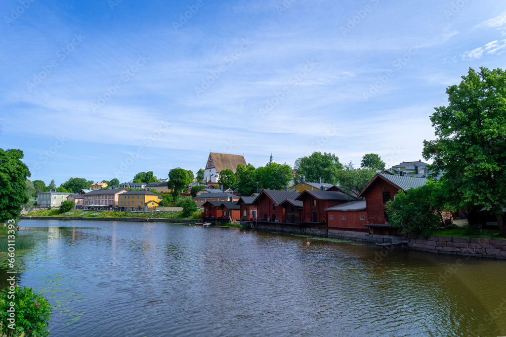 Panoramic view of the city of Porvoo in Finland. Little red houses next to the river. Day with clouds in the sky. Panoramic view of the city of Porvoo in Finland. Little red houses next to the river. Day with clouds in the sky.