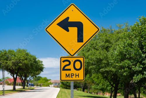mph and turn signal. road sign of 20 mph and turning signal. caution yellow roadsign. traffic sign on the road outdoor. attention caution road sign