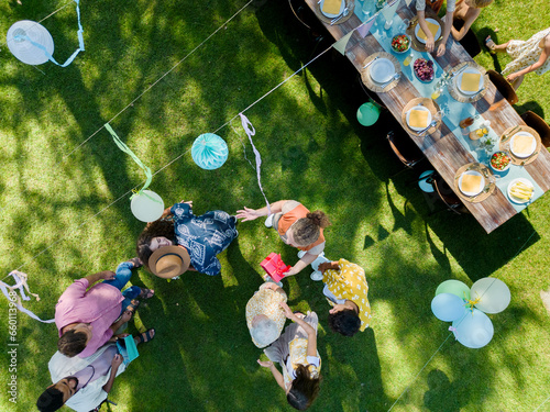 Fotografie Top view of a garden party with decorations and set table
