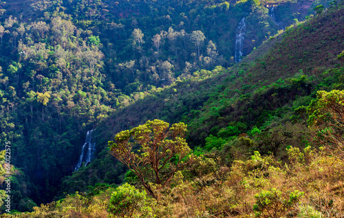 Beautiful mountains covered by forest and waterfalls on a sunny morning in the state of Minas Gerais in Brazil