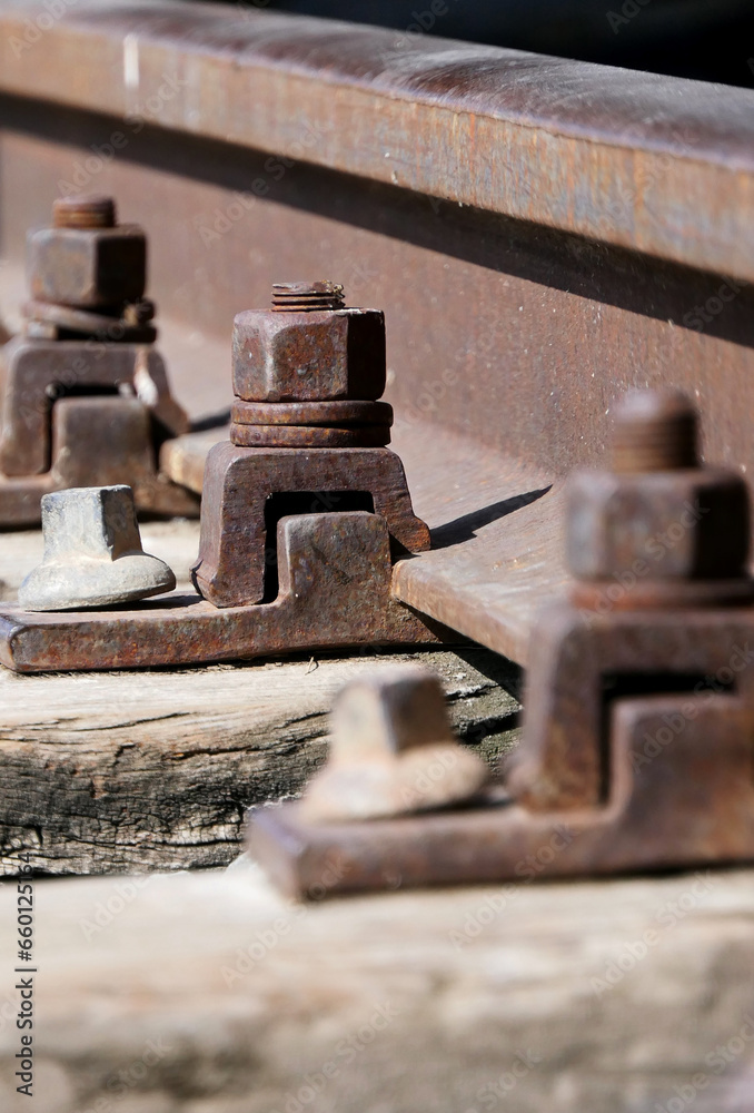 close-up of rusty iron bolts on the railway close-up of rusty iron bolts on the railway